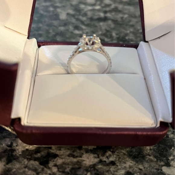 Halo style engagement ring